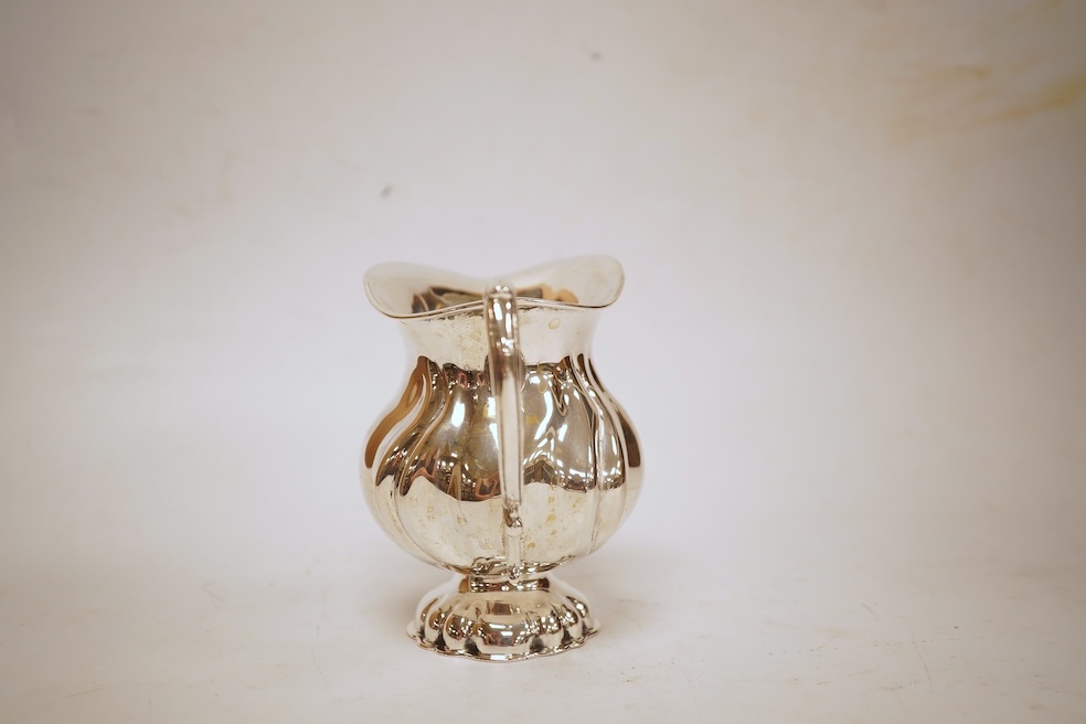 A 20th century Hungarian 800 standard white metal pedestal milk jug, post 1937 mark, height 10.6cm, 7.4oz.